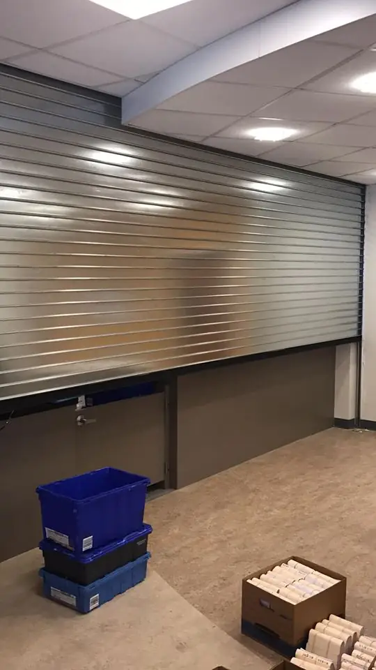 Interior rolling grille closed over a service counter